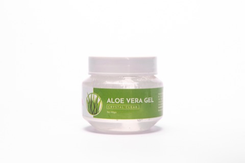 Aloe vera gel jar with a green label against a white background