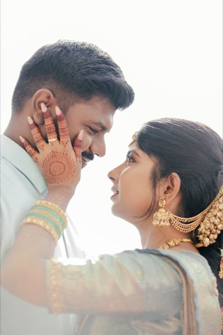 Couple touching foreheads in soft backlighting
