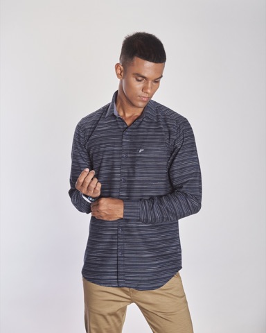 Man modelling a dark striped shirt and beige trousers