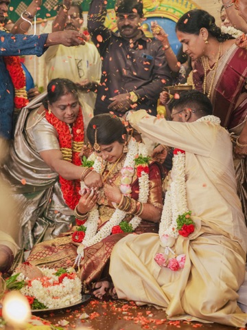 Wedding ceremony surrounded by family and flower petals