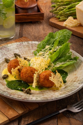 Golden crumbed bites with lettuce and grated cheese