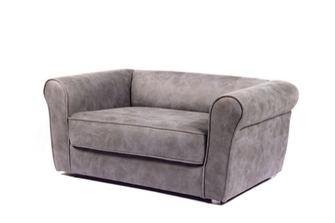 Grey upholstered loveseat against a white background